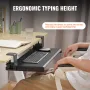 Klem på tastaturbakken under skrivebord